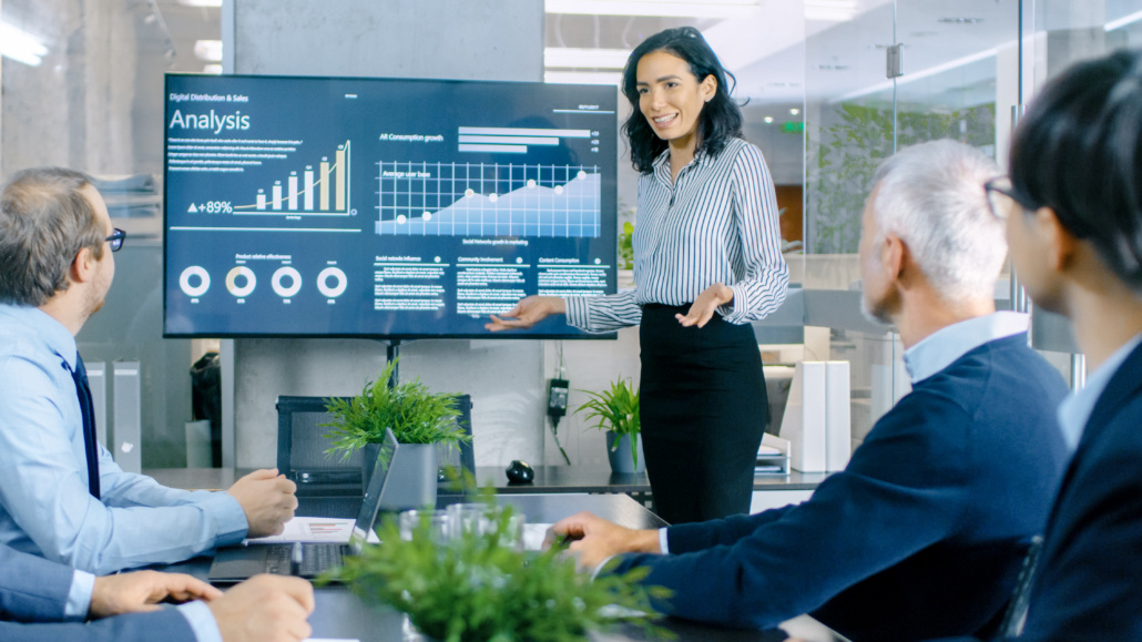 Female leader presenting in a boardroom